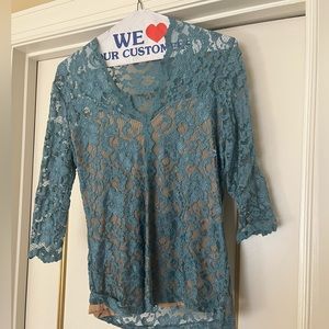 Lace top with built in cami.  Beautiful blue shade